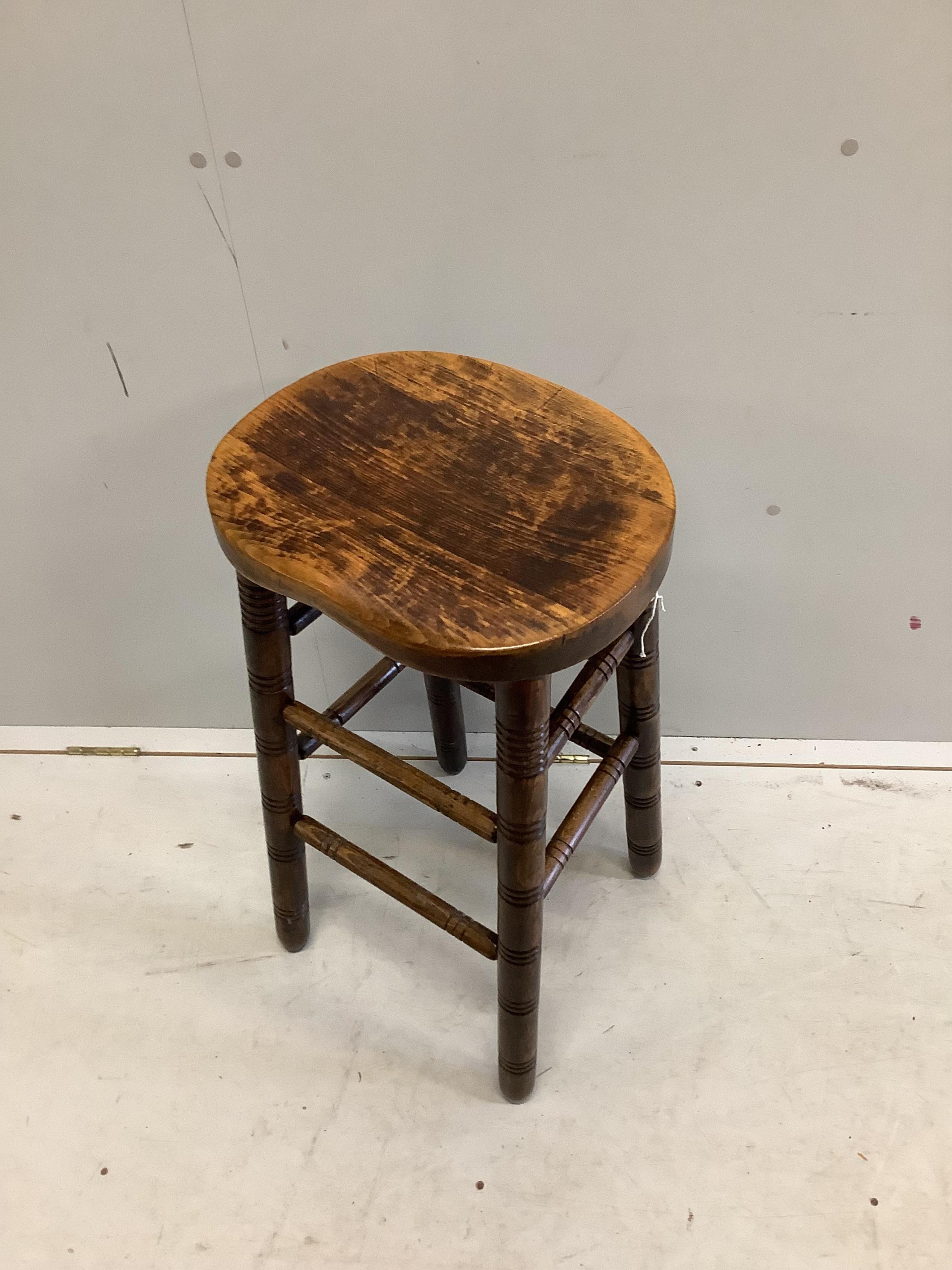 A vintage beech bar stool, height 76cm. Condition - fair to good